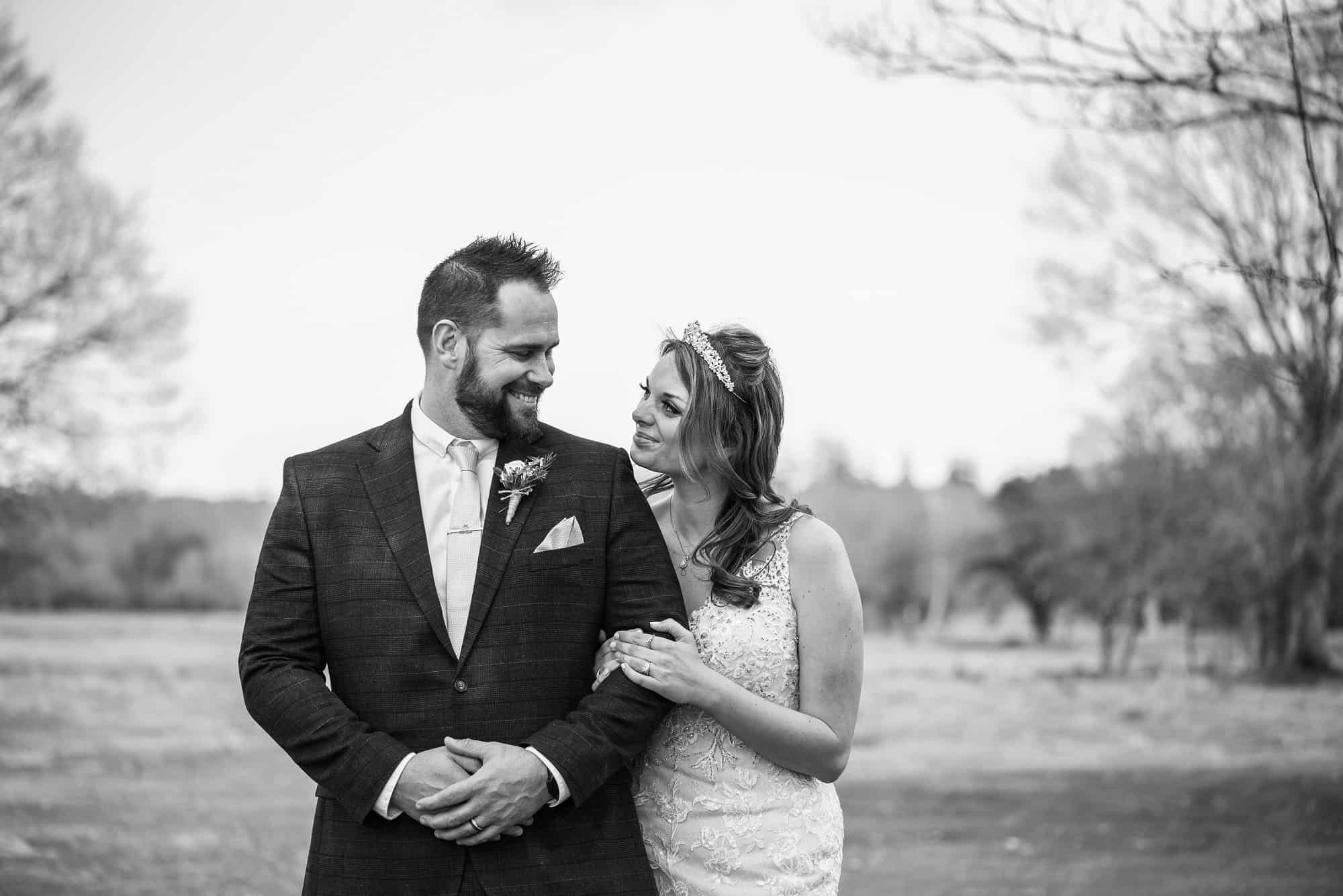Black and white shot of bride and groom on their wedding day